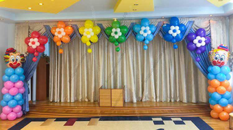 Солнце и радуга из шариков на выпускной в детском саду.